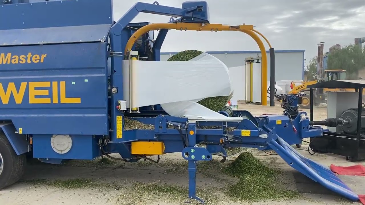 Silopak silage baler and bale wrapper machine in operation