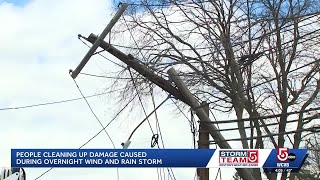 Neighbors survey damage after strong winds sweep across Mass. overnight