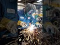 Damaged engine components being repaired with welding tools, bright welding sparks