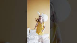 A Young Girl Jumping Up And Down On A Bedcopyright Free Videos