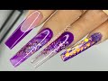 Purple acrylic nail design |