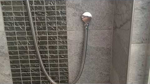 Fitting a water saving restrictor to a shower