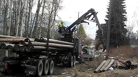FortisBC unloading power poles Castlegar BC
