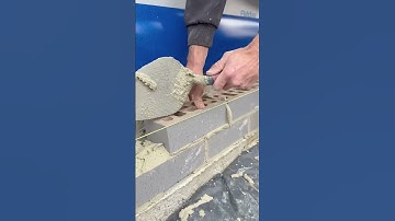 The process of installing bricks for a house wall #shorts