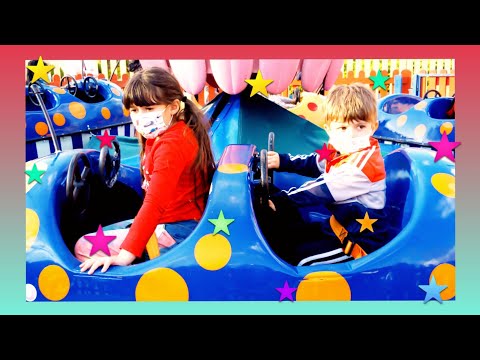 Oli and Johnny have fun in the amusement park