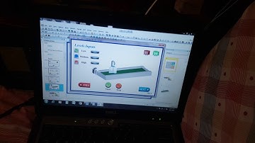 PLC Based Automatic Bottles filler & Interfaced with PC-HMI