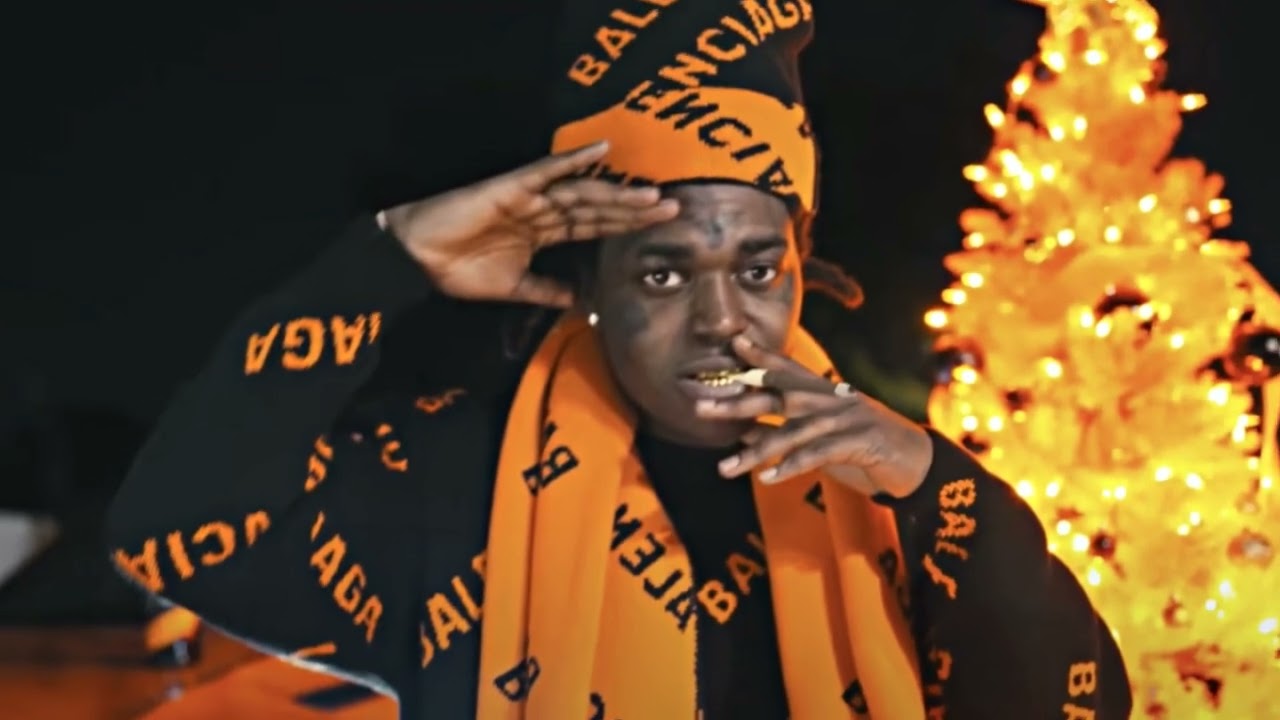 Orange sweatshirt of Kodak Black in Kodak Black - Transportin' [Official  Video]