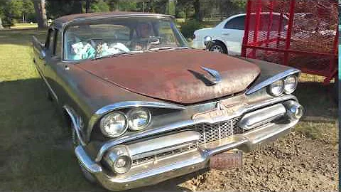 1959 Dodge Royal pulling up to park.