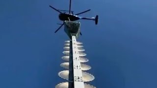 Helicopter With Giant Chainsaw Cuts Tree Branches