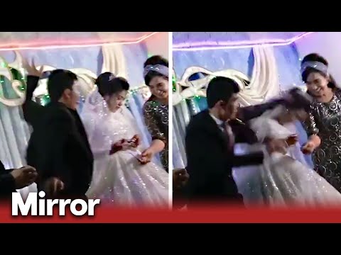 Groom punches bride at their wedding
