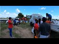 DISTRIBUTING FOOD HAMPERS TO FAMILIES IN NEED # CANE GROVE MAHAICA GUYANA