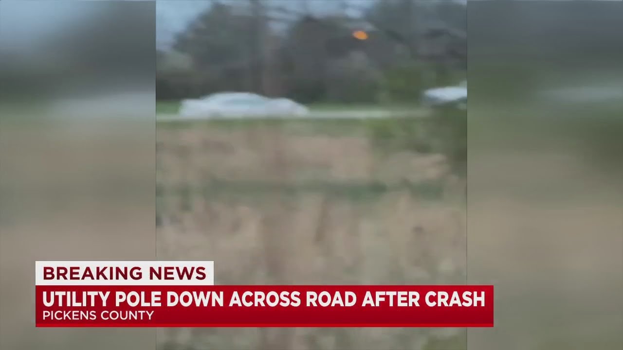 Utility pole down across road after crash - YouTube