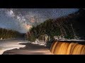 A Time-Lapse of the Milky Way Rising Over the Brown Tahquamenon Falls