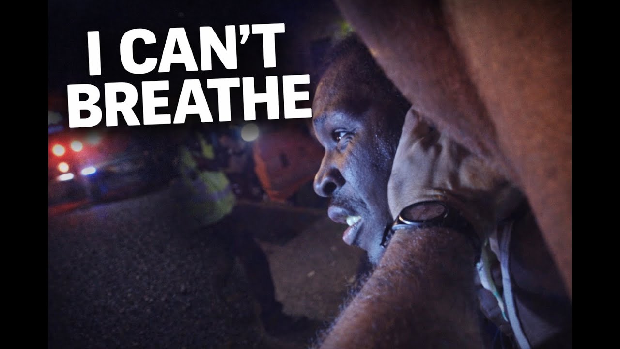 Black Man Pinned to Ground Over Jaywalking Begs I Can’t Breathe