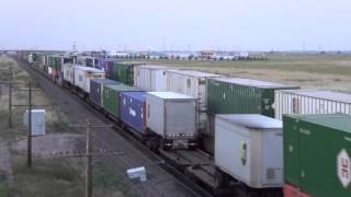 WBD Union Pacific stack train highballing into Cheyenne past stopped EBD train7/18/14 00045