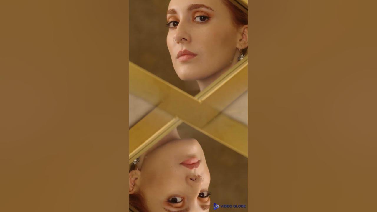 MOCKUP PI009 T shirt Video of a Woman looking at herself in a mirror MOCKUP PI009 T shirt Video of a Woman looking at herself in a mirror