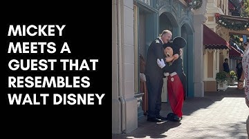 Mickey Mouse meets a guest that resembles Walt Disney on Dapper Day 2022