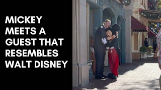 Mickey Mouse meets a guest that resembles Walt Disney on Dapper Day 2022