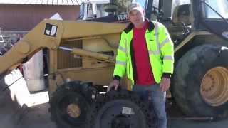 Sports Performance Mclaren Solid Cushion Tires on CAT backhoe