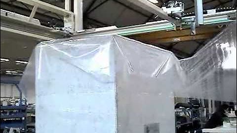 Turntable automatic pallet wrapper with top sheet