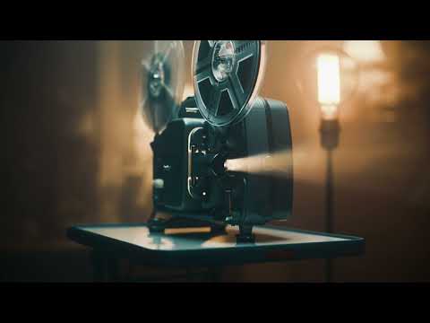 vintage movie projector in a dimly lit room   Stock Video Footage 4K 4K