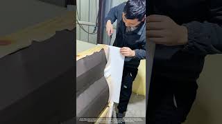 Hand-Trimmed Foam Padding Crafting A Soft Bed Headboard In A Factory