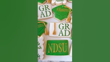 Graduation Cookies. I made the cookies using fondant, a stencil and Walmart cookie icing.