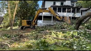 EXCAVATOR and WOOD CHIPPER clearing storm DAMAGE
