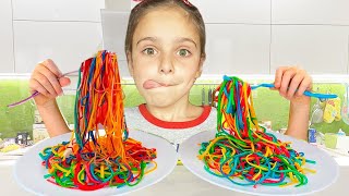 Lidia and Mom are preparing colored noodles and foam