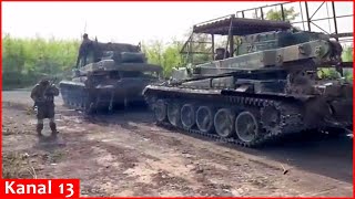 Russian soldiers evacuate the captured Abrams tank from battlefield - \\