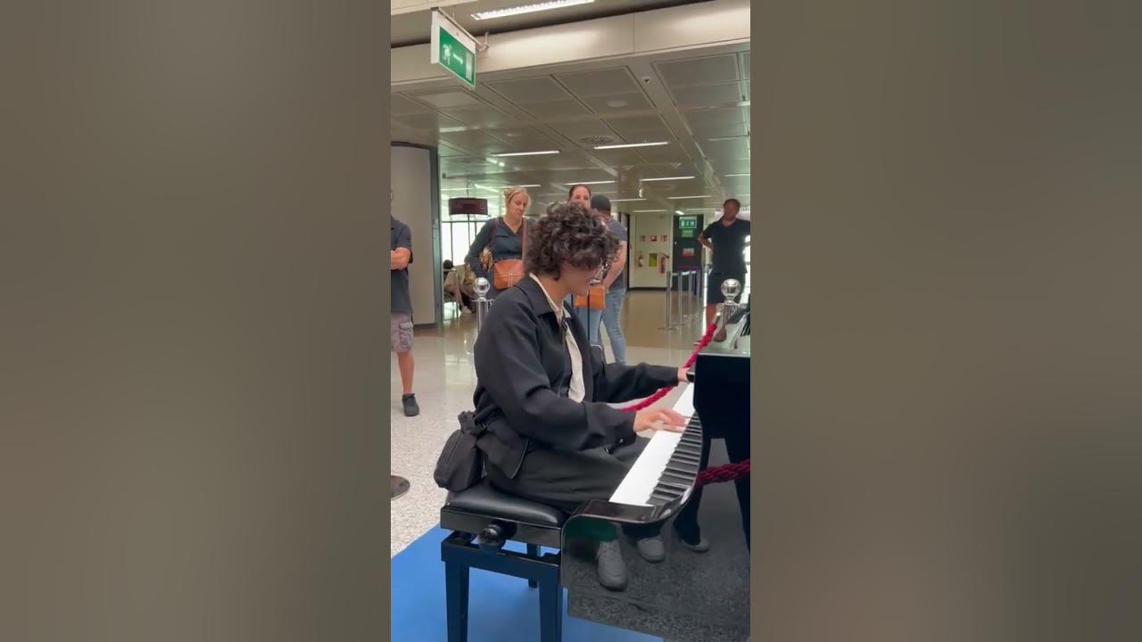 Playing Still Dre at the rome airport on a public piano!