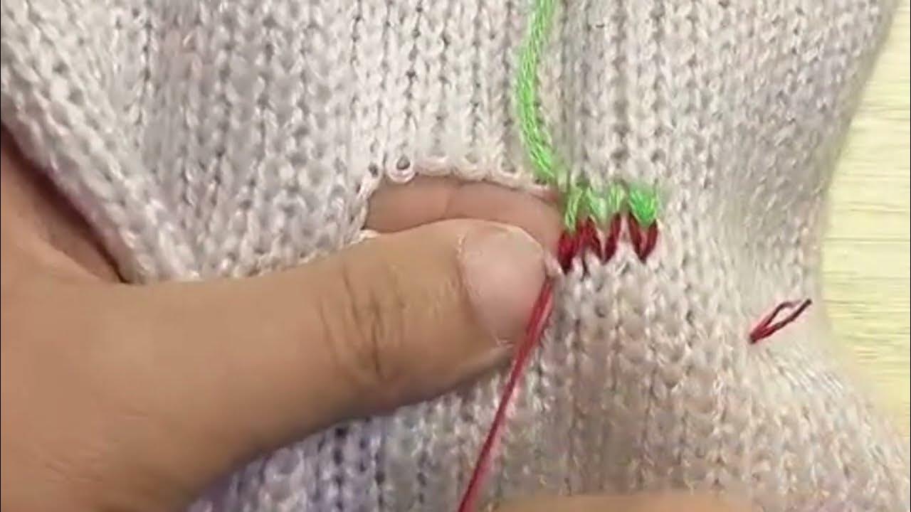 Two broken threads and holes in cashmere sweater are perfectly repaired