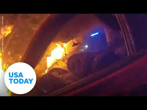 Two Atlanta police officers rescue man from burning car | USA TODAY