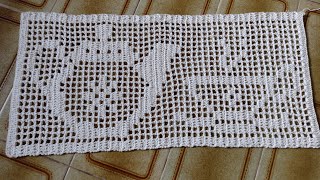 Crocheted teapot and teacup rug. Finishing touches are in progress.
