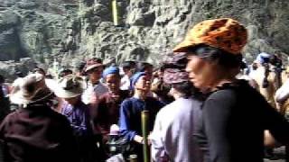 Woman hits herself during prayer (Perfume Pagoda, Vietnam)