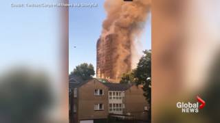 Distraught witnesses look on as massive blaze engulfs London apartment block