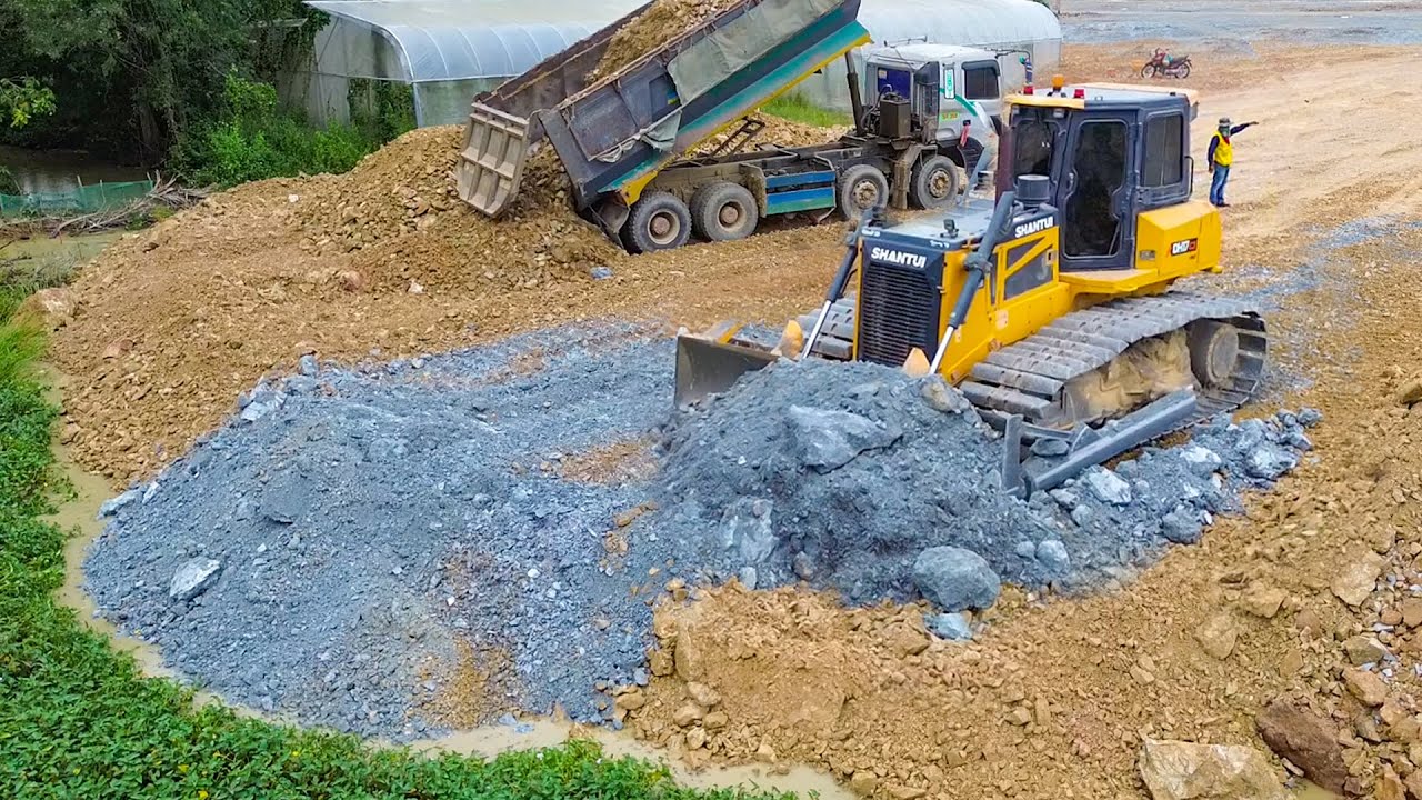 Perfectly By Shantui Dozer Building Road Construction Over The Water Using Stone For Cleaning Forest
