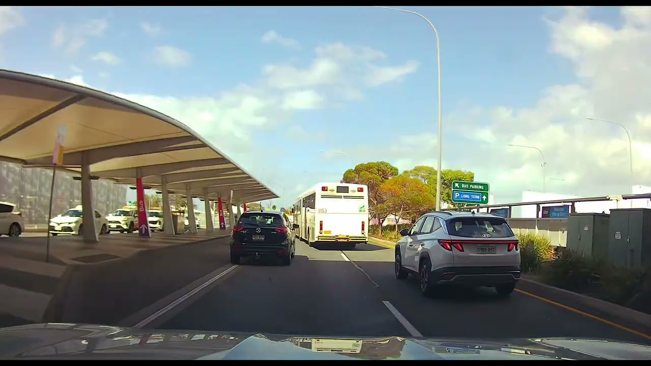 Bus driver want to run over cars/ Scaring Car drivers while changing lane at Adelaide Airport