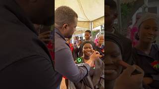 Hon. John Dumelo applying makeup at the matriculation photoshoot for students of University of Ghana