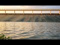 peaceful view of water flowing over the dam under the soft evening light. #relaxing music#natural