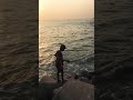 Young boy fishing in the seashorepallampallam beachpallam thurai