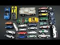 Various metal car model miniatures on a black table