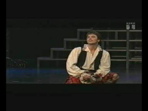 The second part of the show "Musical of the Year 1996" - Host is once again Sir Peter Ustinov. Highlights from the evenings winning Musicals from all categories; including The Three Musketeers, Enter The Guardsman, Red Red Rose, featuring John Barrowman, Claire Moore & Joanna Riding. 1) The Three Musketeers Music by: George Stiles Lyrics by: Paul Leigh Book by: Peter Raby Concept by: William Hobbs Orchestrations by: David Cullen Cast: D'Artagnan: Alexander Hanson Athos: James Graeme Porthos: Nick Holder Aramis: Leo Andrew Queen Anne: Joanna Riding Constance: Jenna Russell Milady: Claire Moore And The Jeff Thacker Dancers 2) Enter The Guardman Music by: Craig Bohmler Lyrics by: Marion Adler Book by: Scott Wentworth Orchestrations by: David Firman Cast: Playwright: Denis Quilley Actor: Clive Carter Actress: Joanna Riding Dresser: Claire Moore Prompter: Leo Andrew Wigmaster: Nick Holder Stage Manager: James Graeme 3) Red Red Rose Music by: Paul Allan Johnson Lyrics by: George Rosie Orchestration by: David Maddux Cast: Robert Burns: John Barrowman Lady Jean: Jenna Russell Maggie: Joanna Riding Jean Armour: Claire Moore Dundas: James Graeme Blair: Nick Holder Soloist: Leo Andrew The Jeff Thacker Dancers