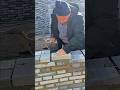 Building a Strong Brick Wall with Careful Hand Placement and Smooth Cement Finishing #shorts