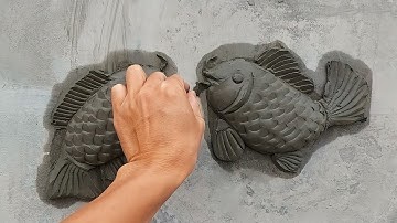 Make a bas-relief of two fish entwined with sand cement