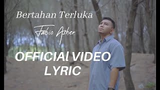 Video thumbnail of "Fabio Asher - Bertahan Terluka ( Lyric Video )"