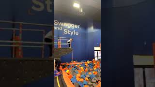 Jumping into the foam pit at sky zone