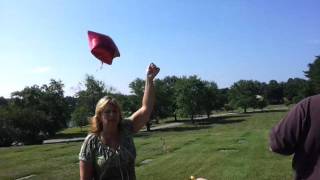 Grandma Karen releasing a balloon for Jayden
