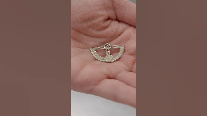 IWC Surface Finisher Lorena Schudel loads ceramic media and grinding compound into the drum.