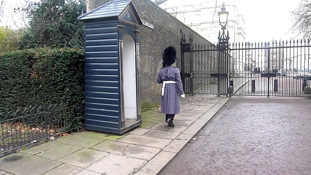London Guard Hiding from Rain - YouTube